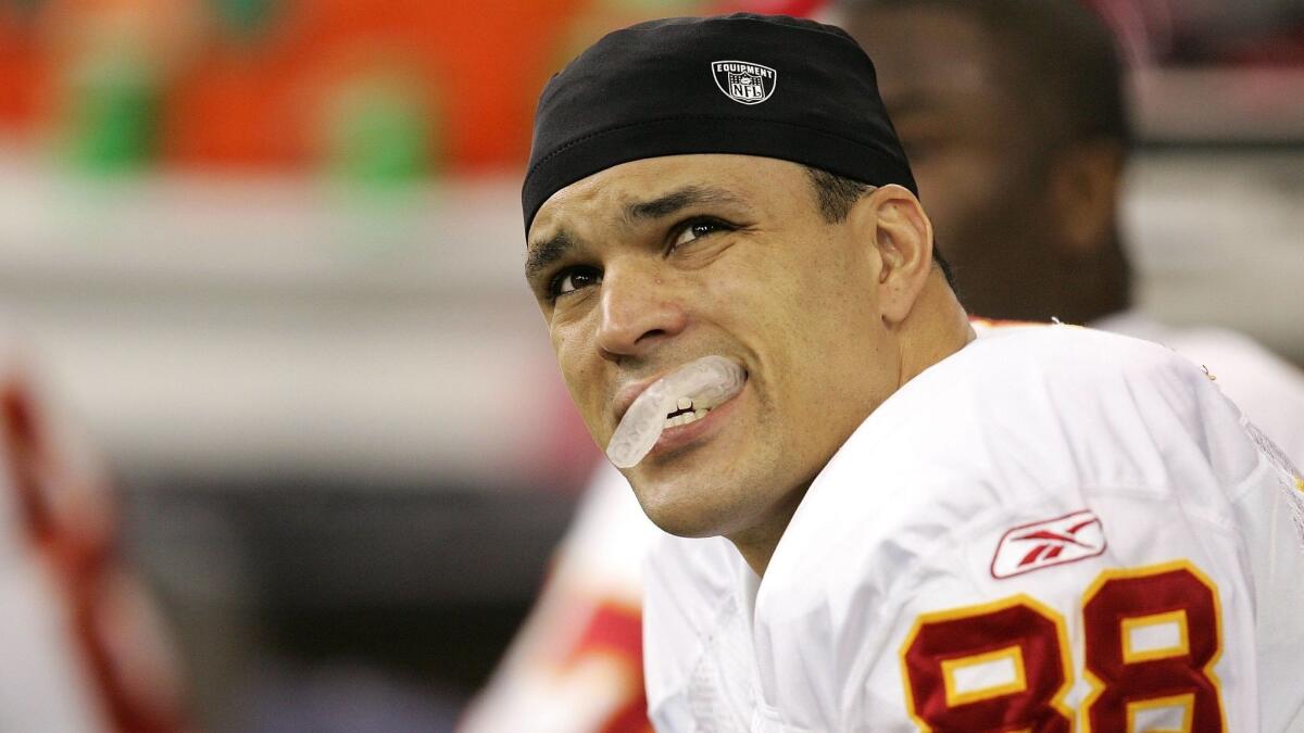 Tony Gonzalez of the Kansas City Chiefs looks on from the bench against the Indianapolis Colts during their AFC wild-card game on Jan. 6, 2007, at RCA Dome in Indianapolis, Indiana.