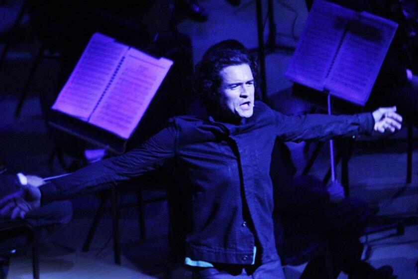 Orlando Bloom performs with the Simon Bolivar Symphony Orchestra.