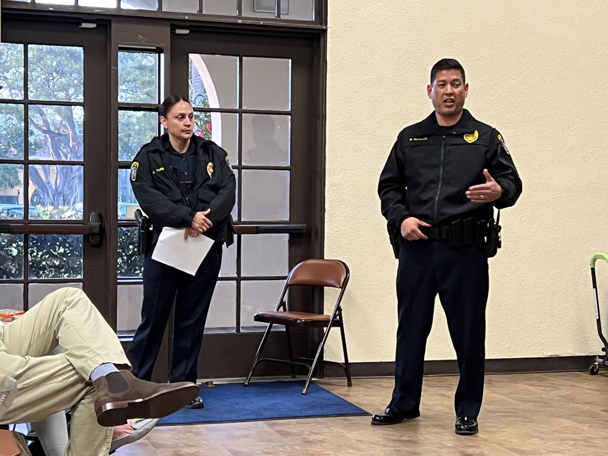San Diego police Community Relations Officer Jessica Thrift and Lt. Rick Aguilar speak at a La Jolla Town Council meeting.