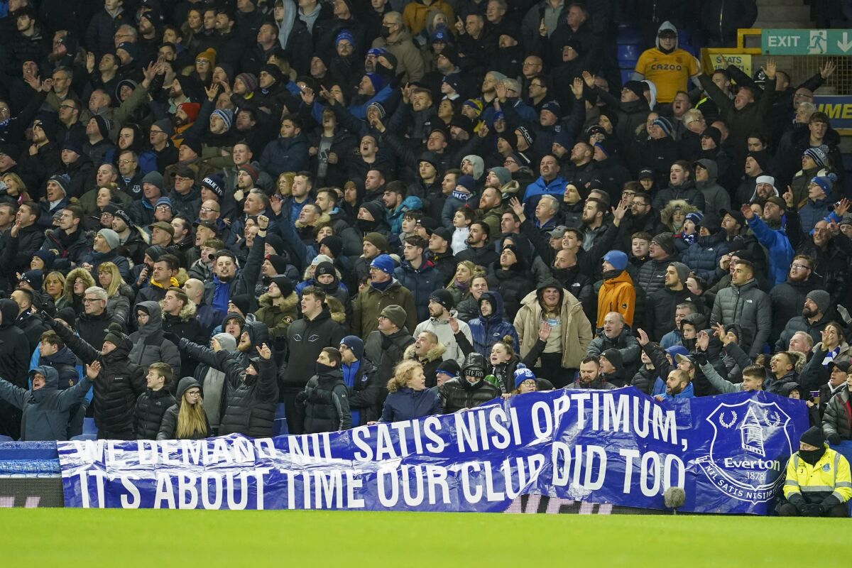 Everton supporters show a banner during the Premier League soccer match between Everton and Arsenal at Goodison Park in Liverpool, England, Monday Dec. 6. 2021, 2021. (AP Photo/Jon Super)