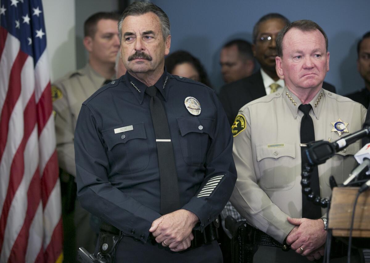 Los Angeles Police Chief Charlie Beck, left, and Los Angeles Sheriff Jim McDonnell on Dec. 15, 2015.