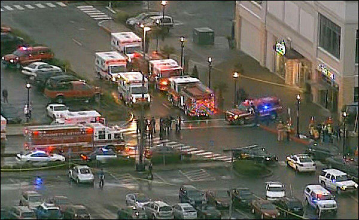 Emergency vehicles arrive after a shooting at the Clackamas Town Center mall near Portland, Ore.