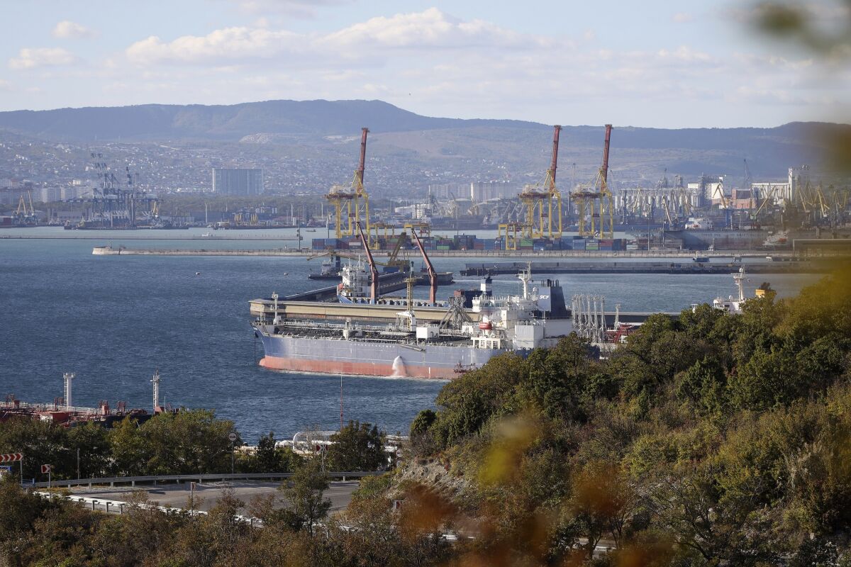 FILE An oil tanker is moored at the Sheskharis complex, part of Chernomortransneft JSC, a subsidiary of Transneft PJSC, in Novorossiysk, Russia, Tuesday, Oct. 11, 2022, one of the largest facilities for oil and petroleum products in southern Russia. The European Union is edging closer to a $60-per-barrel price cap on Russian oil. It's a highly anticipated and complex political and economic maneuver designed to keep Russian oil flowing into global markets while clamping down on President Vladimir Putin’s ability to fund his war in Ukraine. EU nations sought to push the cap across the finish line Thursday, Dec. 1, 2022 after Poland held out to get as low a figure as possible. (AP Photo, File)