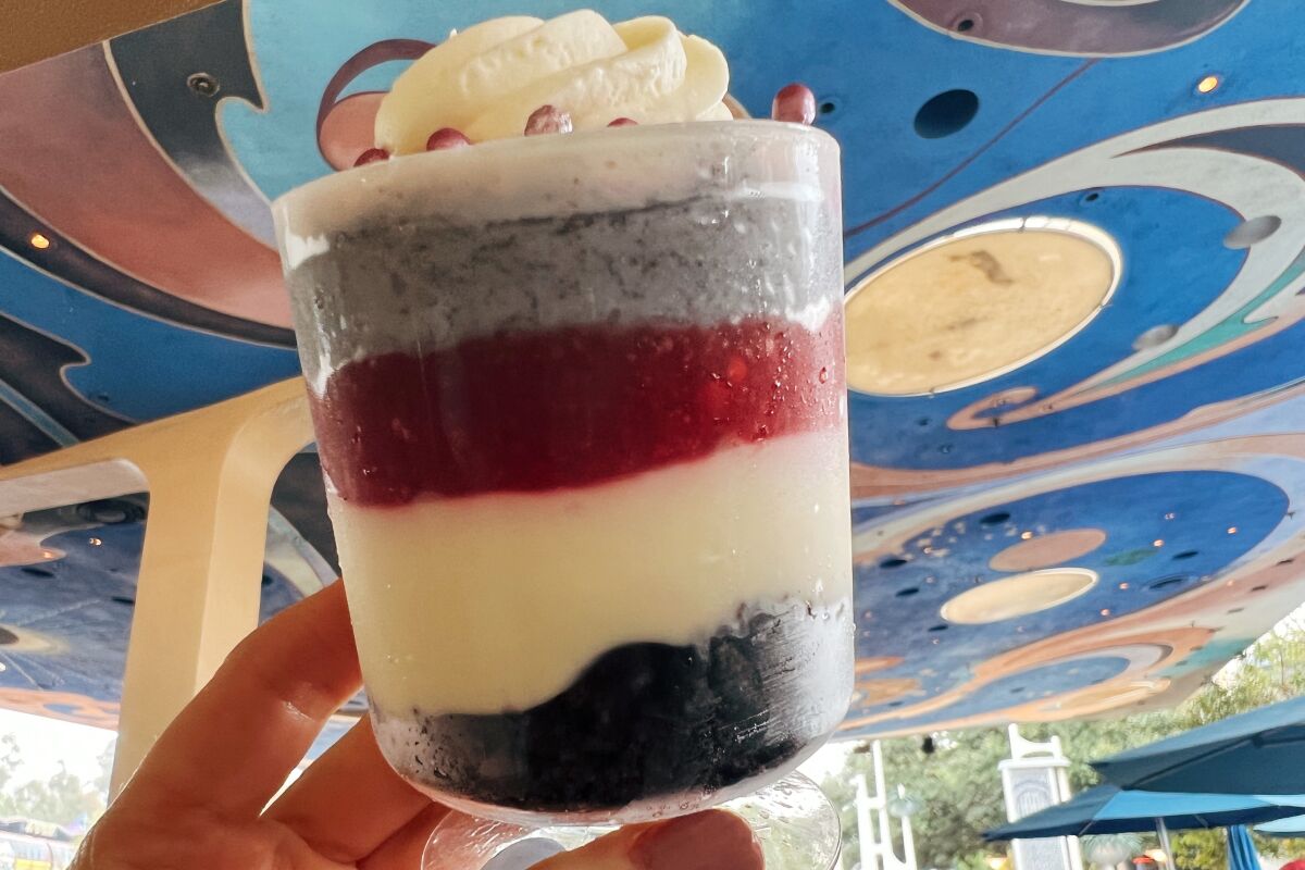 A Platinum Trifle with layers of chocolate cookie crumbles, cheesecake, cherry compote and more at Galactic Grill