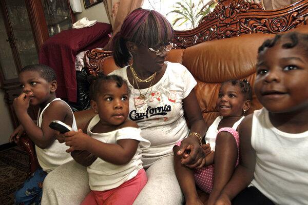 Denise Peace of Brooklyn, N.Y., has been taking care of five grandchildren, ages 2 to 17, since her daughter was killed by stray gang gunfire last year.