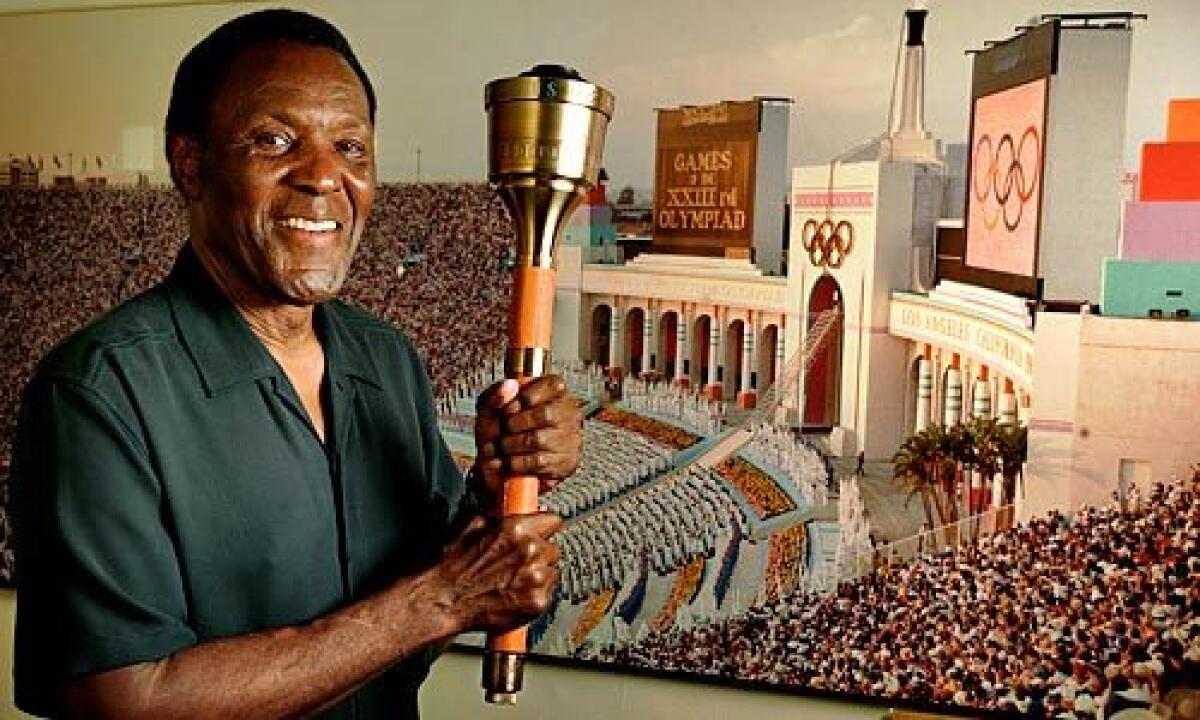Rafer Johnson lit the Olympic flame at the opening of the 1984 Summer Games in Los Angeles.