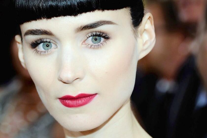 Rooney Mara sports dramatic eyes and lips at the Oscars ceremony.