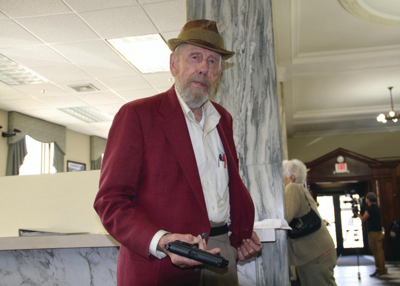 In this Sept. 29, 2017, photo, actor Rance Howard flashes a fake pistol prop for the film "Appleseed," in which Howard is costarring, in St. Johnsbury, Vt. Director Ron Howard says his father Rance Howard died Saturday, Nov. 25, 2017 at age 89. Read more.