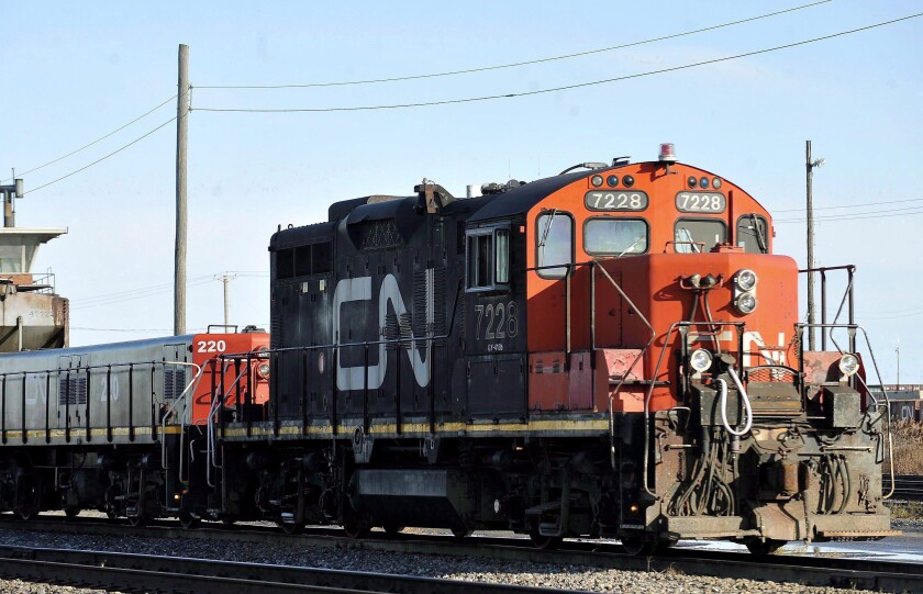 A Canadian National locomotive goes through the Canadian National Taschereau yard in Montreal, Saturday, Nov. 28, 2009. Canadian National sweetened its offer to buy Kansas City Southern railroad Thursday, May 13, 2021, and derailed rival Canadian Pacific’s bid for the railroad that handles traffic in the United States and Mexico. (Graham Hughes/The Canadian Press via AP)