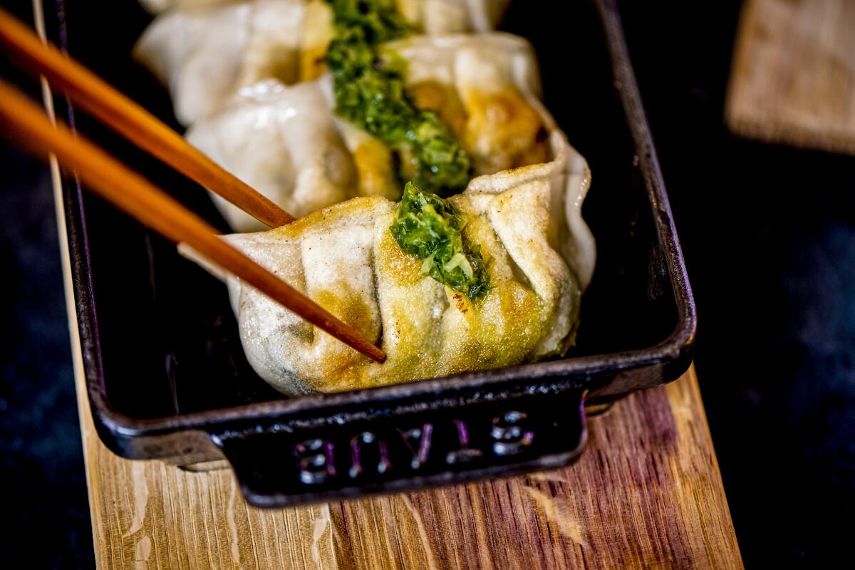 Sa'Moto dumplings in a mini iron baking dish.