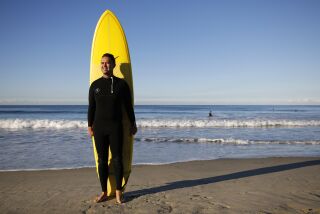 San Diego CA - December 8: Taylor Smith is the CEO and co-founder of Blueboard, an employee rewards company that teller bosses gift cool experiences such as surf lessons to employees. Smith is shown here in Pacific Beach on Thursday, December 8, 2022. (K.C. Alfred / The San Diego Union-Tribune)