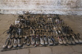 Photo released by the Jalisco state attorney general’s office shows shoes found at Rancho Izaguirre, a cartel training site.