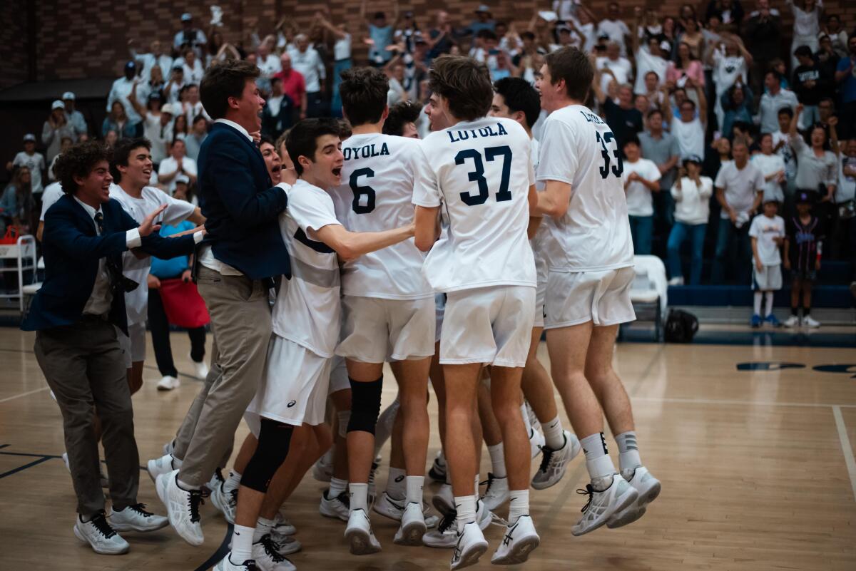 Loyola celebrates winning Southern California regional volleyball championship.