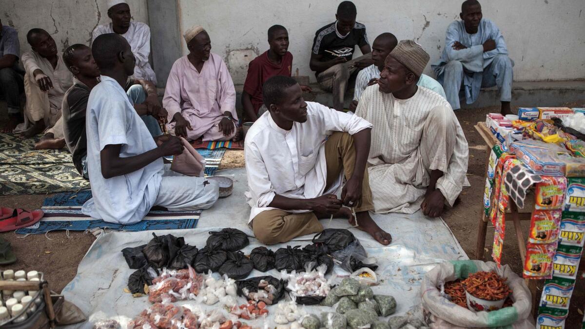 Vendors sell tea, salt and pepper in the town of Banki in northeastern Nigeria.