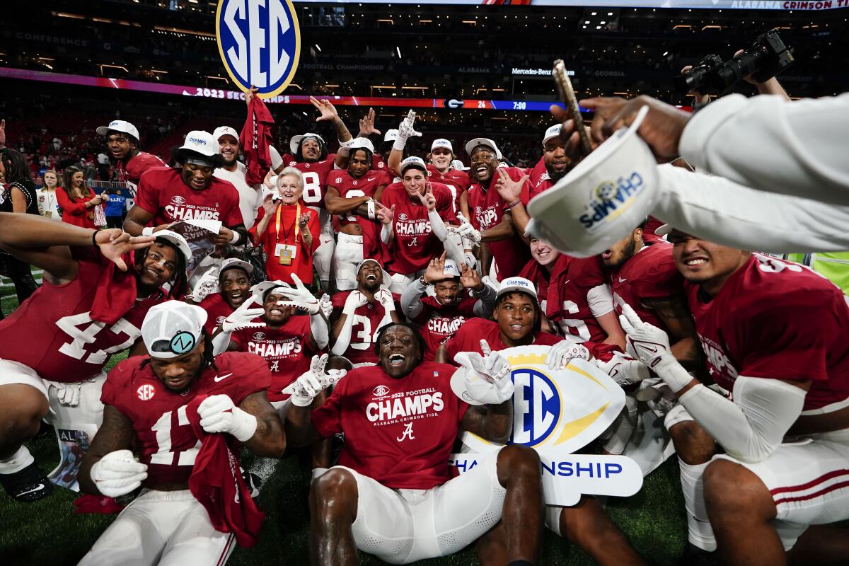Alabama players celebrate after defeating Georgia in the SEC championship game at Mercedes-Benz Stadium.