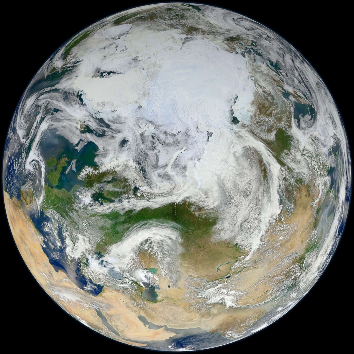 The Earth is seen from over the Arctic as captured by the Suomi National Polar-orbiting Partnership (S-NPP) satellite. The disappearing Arctic sea ice has set off a dangerous feedback loop -- warming that feeds on itself -- as dark heat-absorbing water replaces the white ice that used to reflect heat back to space.
