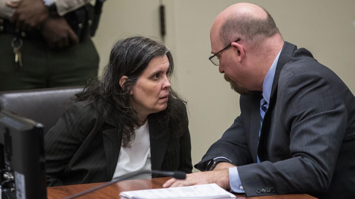 Louise Turpin consults with her attorney, Jeff Moore, in Riverside County court on Thursday.