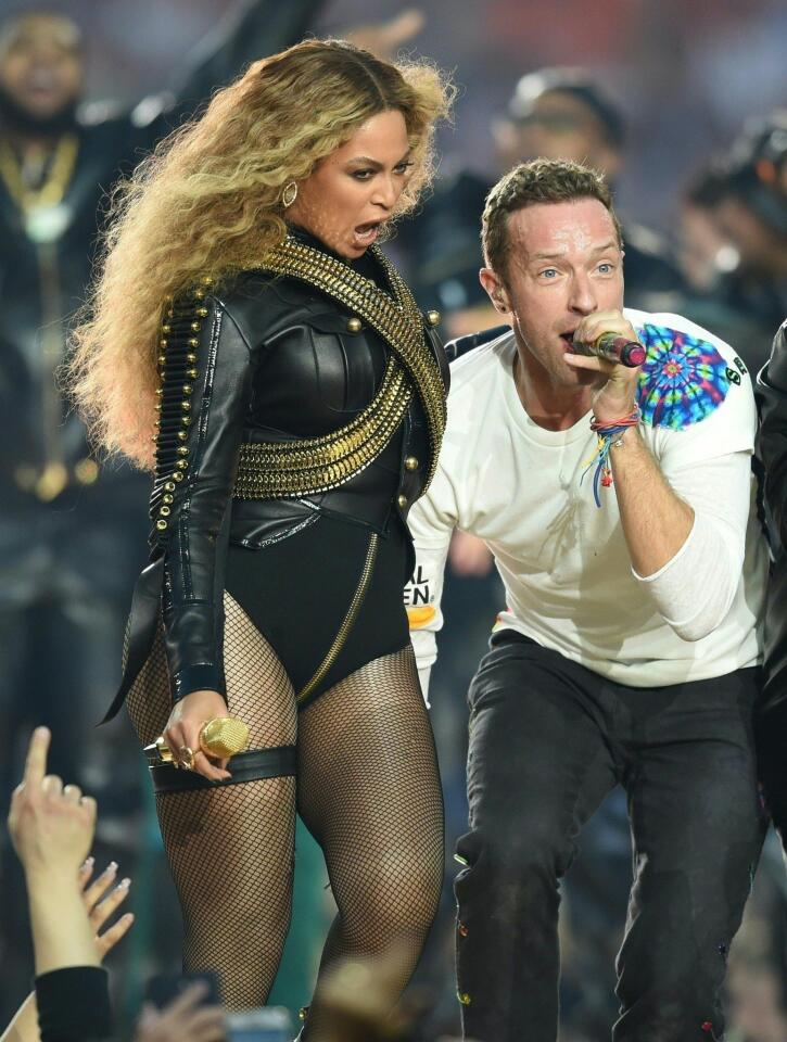 Beyonce and Chris Martin perform during Super Bowl 50 half time show at Levi's Stadium in Santa Clara, California. TIMOTHY A. CLARY/AFP/Getty Images