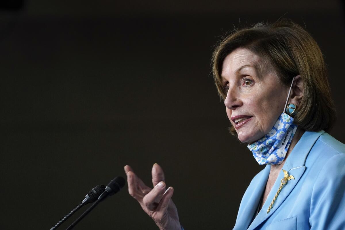 House Speaker Nancy Pelosi (D-San Francisco) speaks before a microphone.