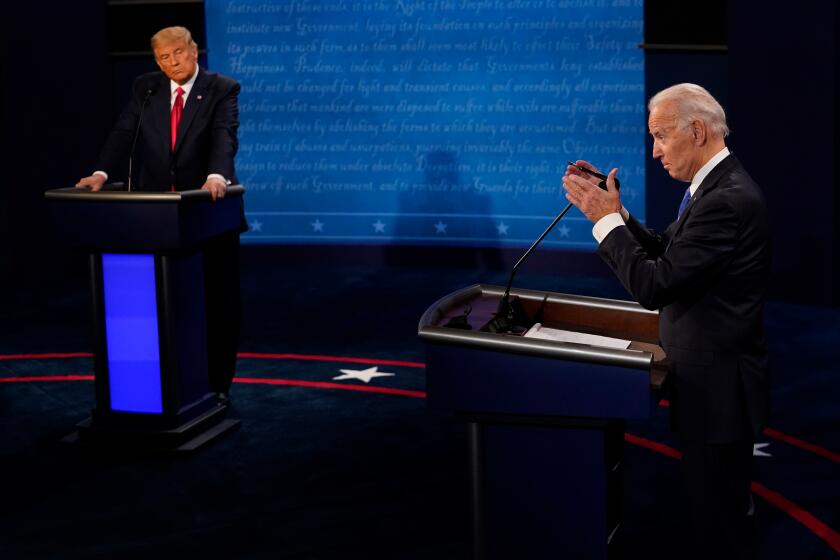 Debate stage with Donald Trump on the left and  Joe Biden on the right, each behind a podium