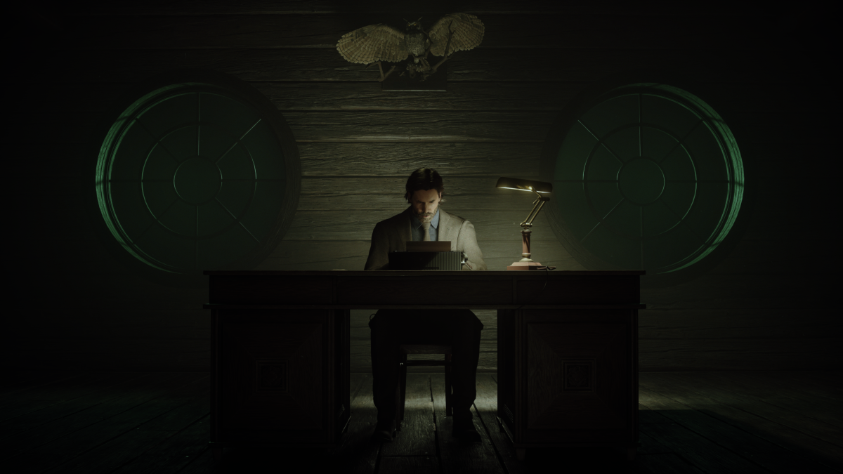 Alan Wake sits a typewriter in "Alan Wake II." 