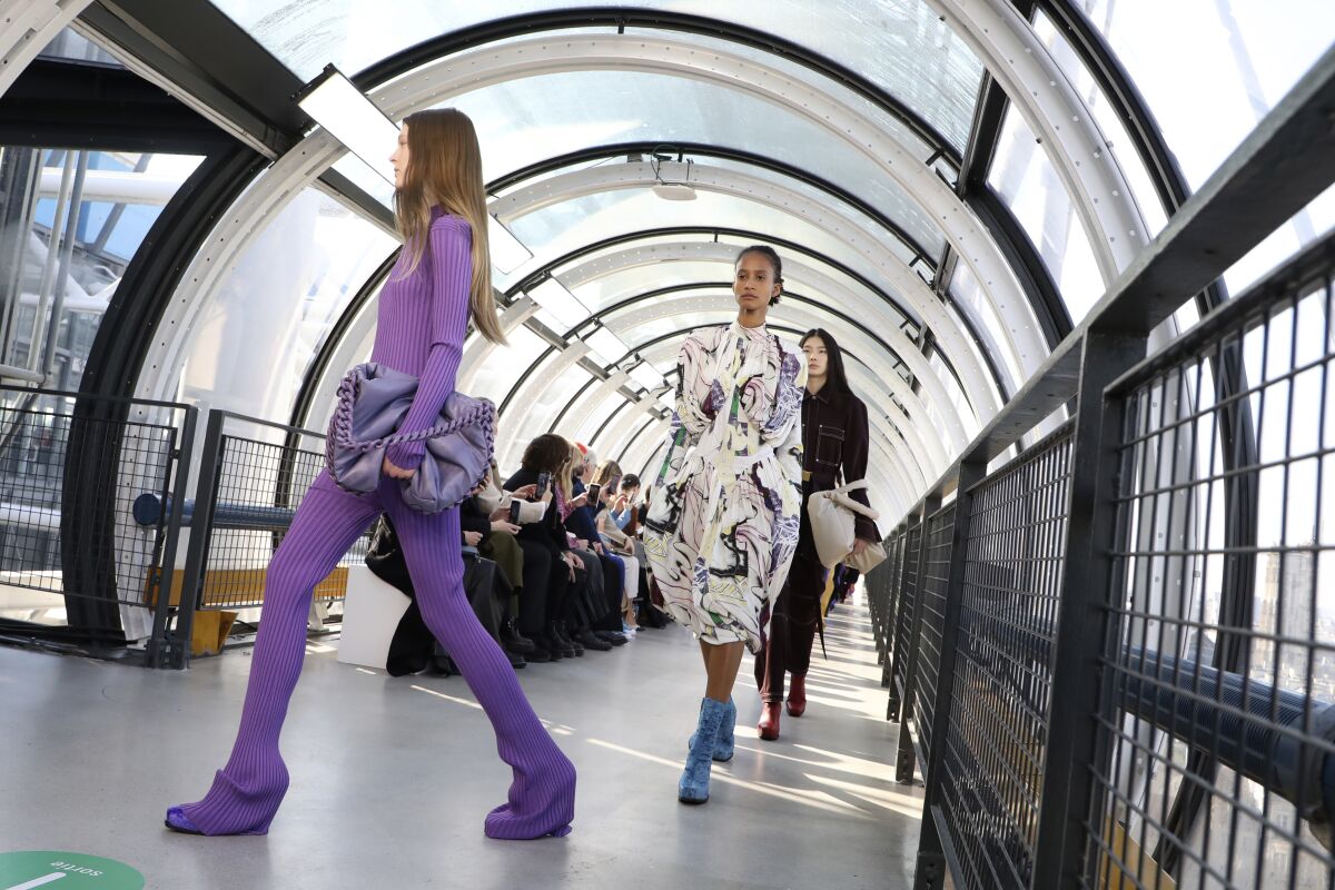 Models wear creations for the Stella McCartney Ready To Wear Fall/Winter 2022-2023 fashion collection, unveiled during the Fashion Week in Paris, Monday, March 7, 2022. (Photo by Vianney Le Caer/Invision/AP)