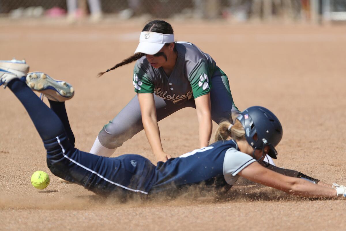 Newport Harbor's Olivia Williams slides into third safely after a hit against Twentynine Palms on Thursday.