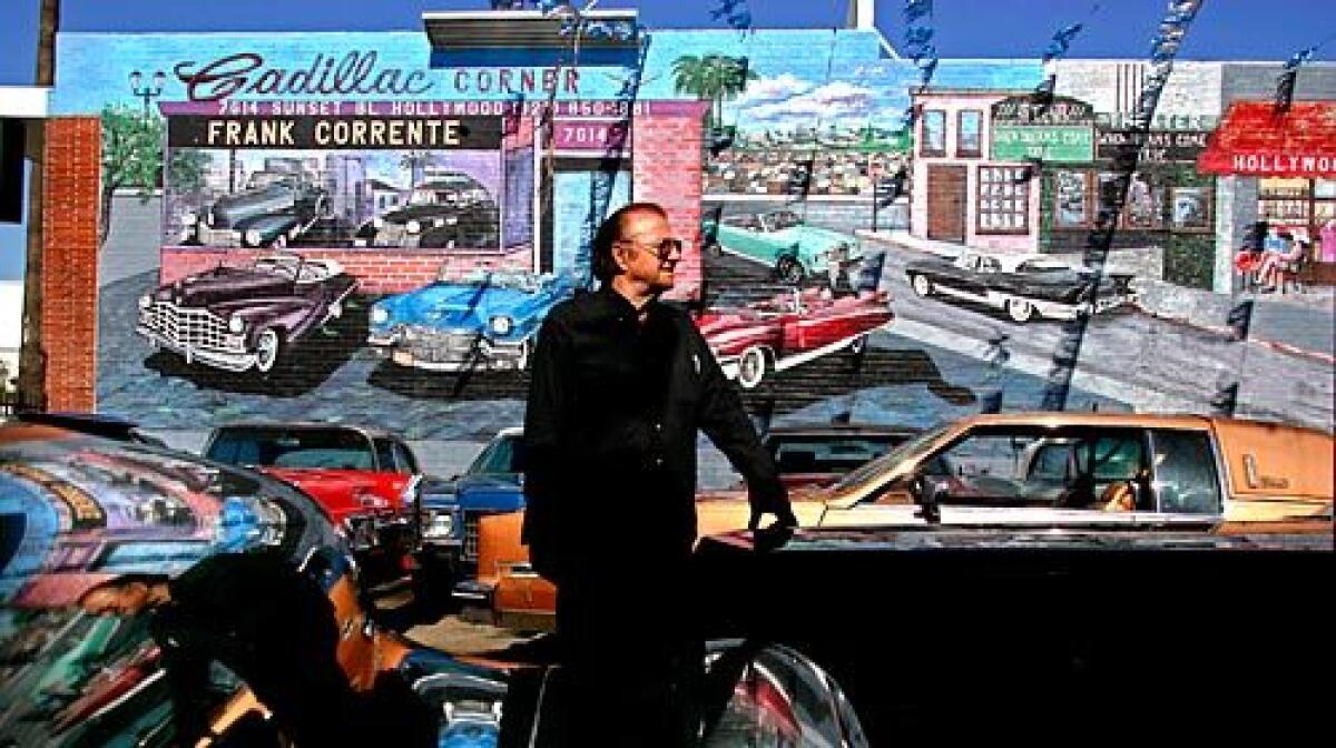 Frank Corrente stands at his Cadillac Corner vintage car lot in Hollywood,. Los Angeles building inspectors say he opened his 21-year-old store without the proper permits. They have ordered him to retroactively file the paperwork and bring the lot up to current standards.