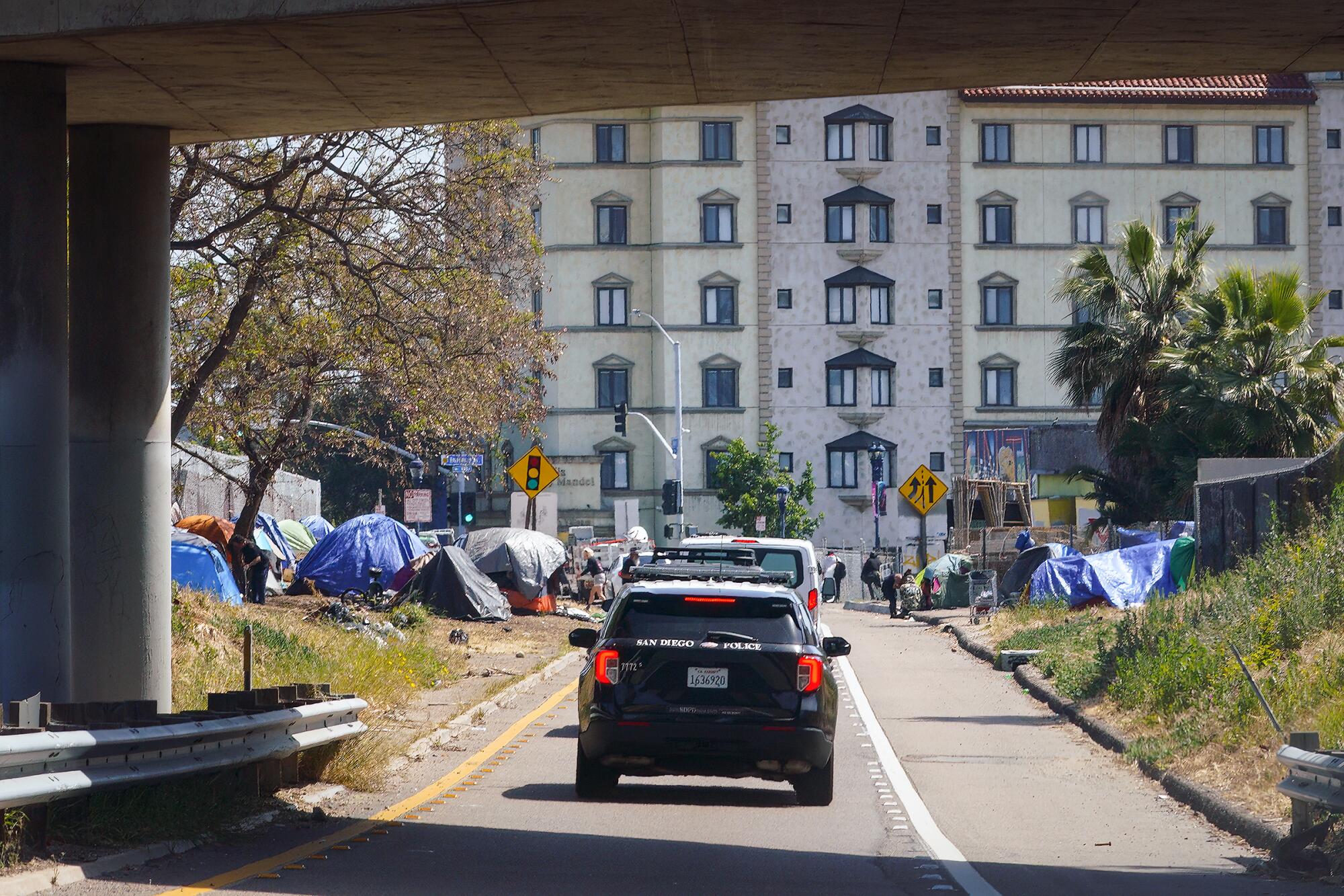 An encampment near the Imperial Avenue offramp on southbound Interstate 5 in San Diego.