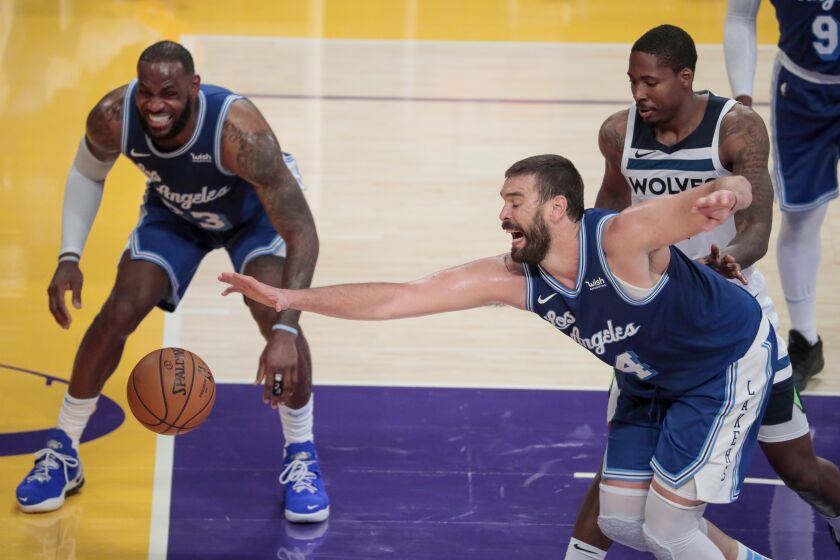 Los Angeles, CA, Sunday, December 27, 2020 - Los Angeles Lakers center Marc Gasol (14) struggles to catch a loose ball as Los Angeles Lakers forward LeBron James (23) looks on during second half action against the Timberwolves at Staples Center. (Robert Gauthier/ Los Angeles Times)