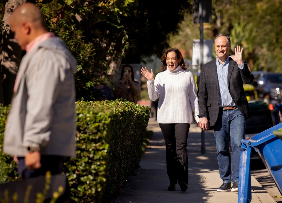 Vice President Kamala Harris and Second Gentleman Doug Emhoff walk through their neighborhood in Los Angeles in 2023.