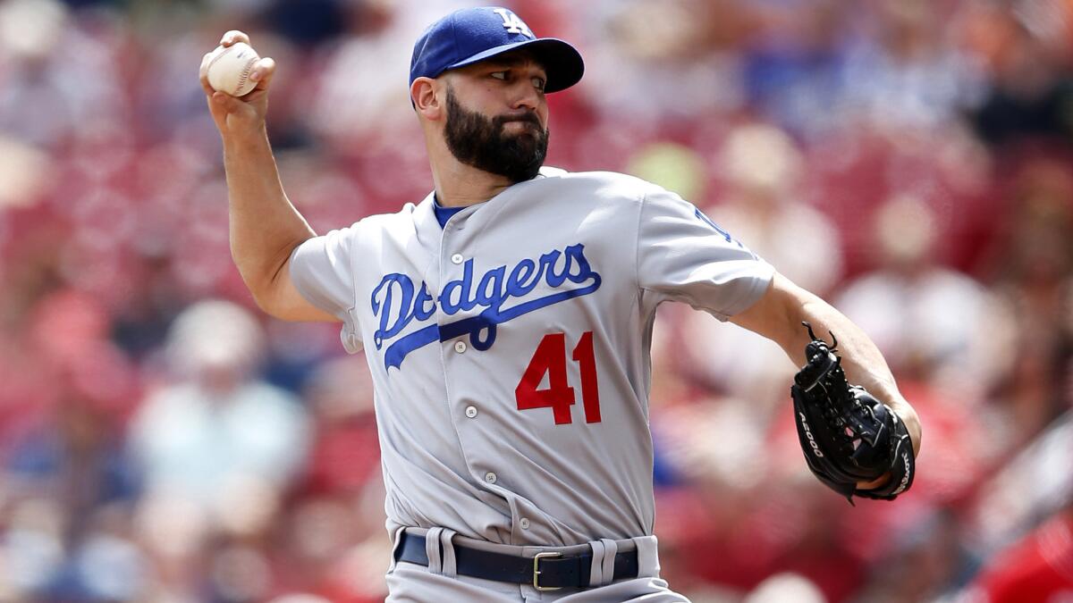 Dodgers reliever Chris Hatcher delivers a pitch in the eighth inning against the Reds on Thursday afternoon in Cincinnati.