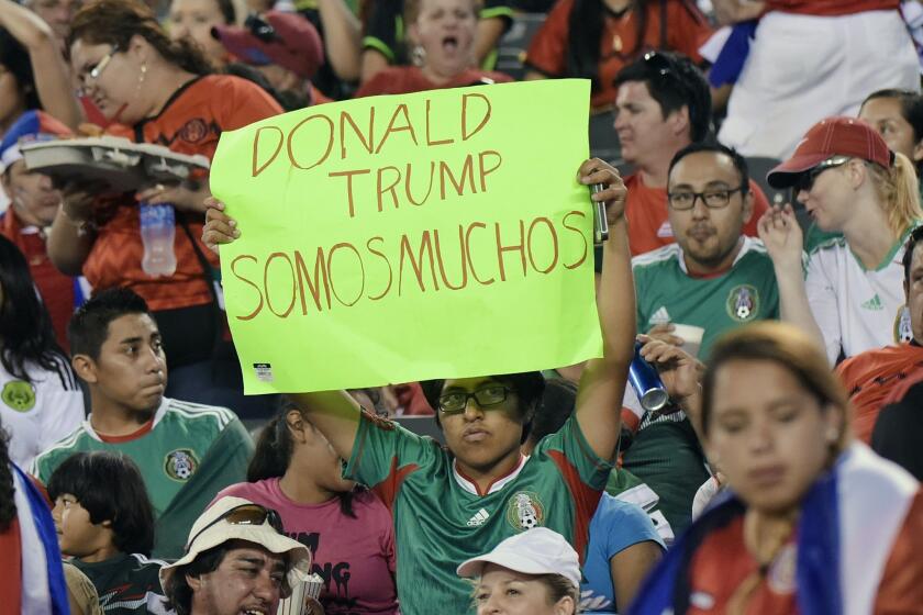 A fan holds a sign during the second half of a CONCACAF Gold Cup soccer match between Mexico and Costa Rica Sunday, July 19, 2015, at MetLife stadium in East Rutherford, N.J. (AP Photo/Bill Kostroun)