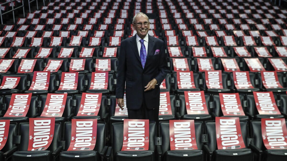 LOS ANGELES, CA, WEDNESDAY, APRIL 10, 2019 - Clippers broadcaster Ralph Lawler poses for photos amid a sea of pladards of his signature “Bingo” call the night he is to broadcast his final regular season game after 40 years. (Robert Gauthier/Los Angeles Times)
