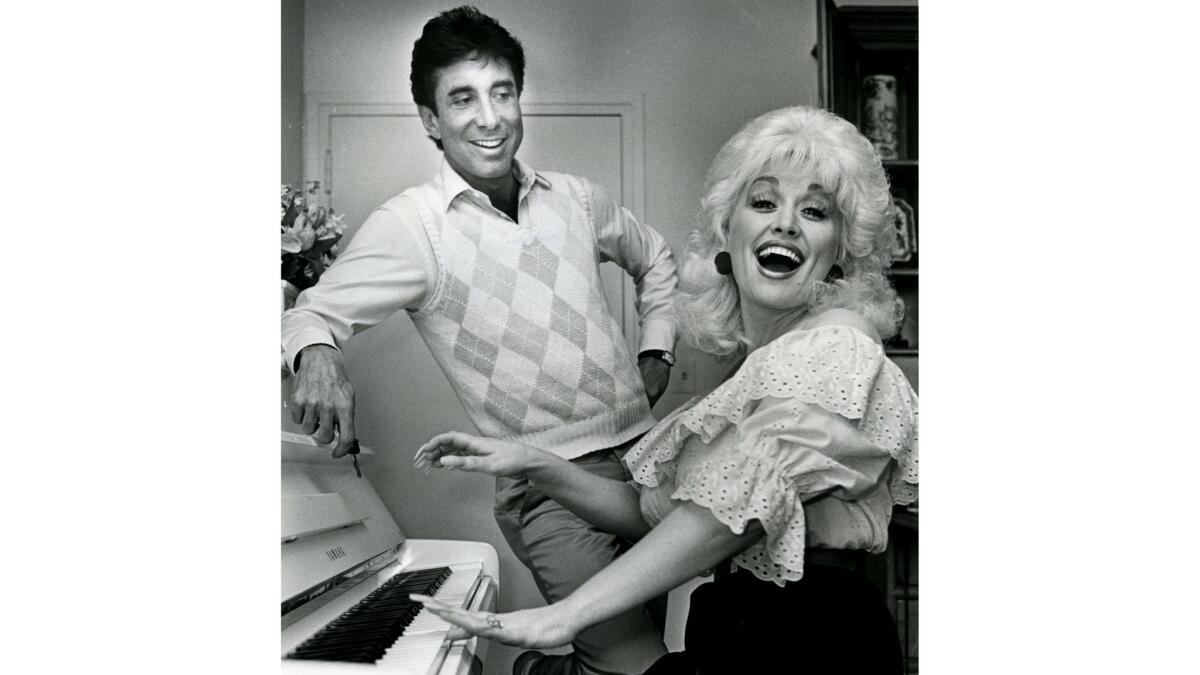 Dolly Parton and Sandy Gallin in 1983.