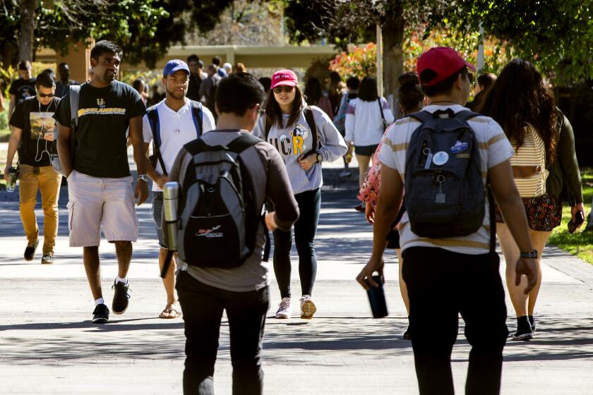 RIVERSIDE, CA - MARCH 9, 2017: The student body population at UC Riverside is very diverse, in fact, African American students thrive at UC Riverside, with some of the nation's highest graduation rates for their demographic on March 9, 2017 in Riverside, California. The Inland Empire campus has no racial disparity in graduation rates, a rare achievement. (Gina Ferazzi / Los Angeles Times)