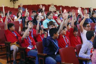 Roosevelt Elementary students raise their hands when asked, "Who in the room has ever done computer programming?" at an artificial-intelligence-based discussion between students and a panel from Beyond Limits at Theodore Roosevelt Elementary School on Monday, September 16, 2019. This is part of Glendale Tech Week.