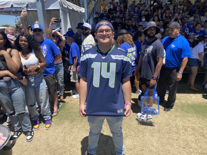 Seattle Seahawks fan Chris Manley (14) poses at Rams training camp in Irvine.