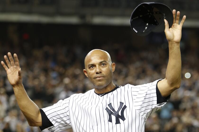 Mariano Rivera acknowledges the crowd's standing ovation on Sept. 26, 2013, after coming off the mound in the ninth inning of his final appearance in a baseball game at Yankee Stadium