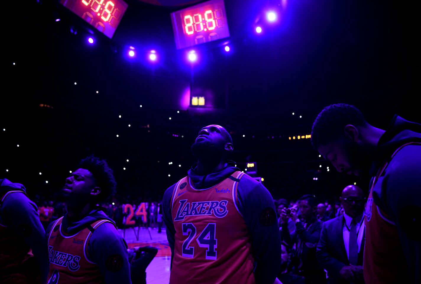 Lakers star LeBron James watches the 24 second clock wind down to honor Kobe Bryant during a ceremony at the Staples Center on Jan. 31, 2020.