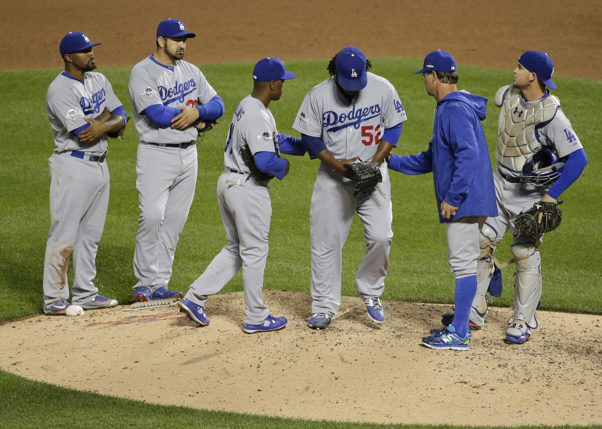 Pedro Baez leaves Game 3 during the seventh inning.