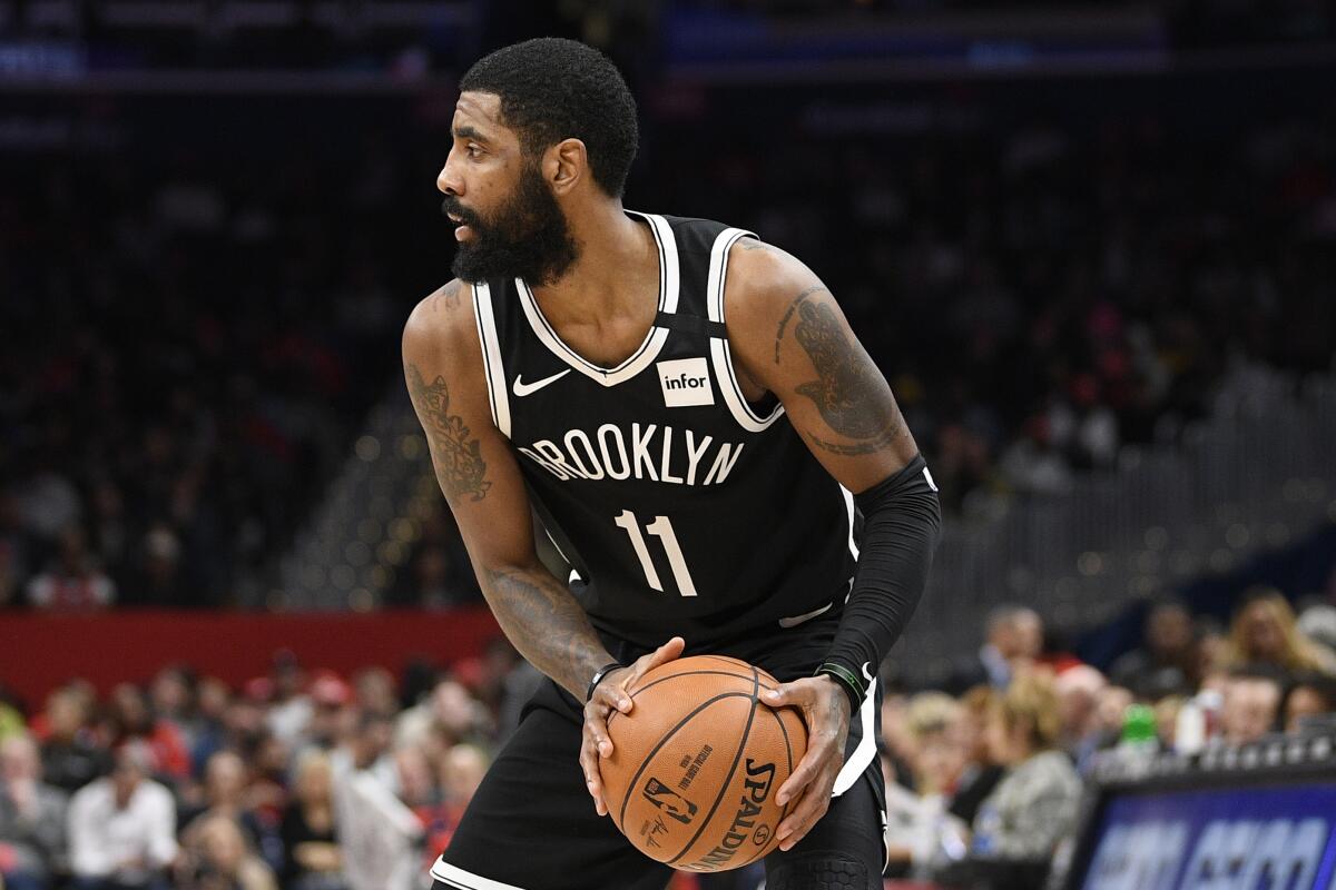 Brooklyn Nets guard Kyrie Irving plays in a game Feb. 1 against the Wizards in Washington.