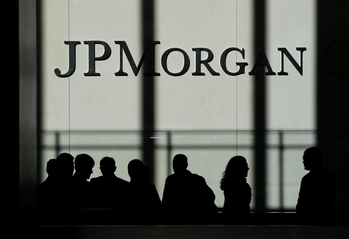 FILE - In this Monday, Oct. 21, 2013, file photo, the JPMorgan Chase logo is displayed at their headquarters in New York. JPMorgan Chase said Tuesday, July 13, 2021, its second quarter profits more than doubled from a year ago — a reflection of the improving global economy and fewer bad loans on its balance sheet. (AP Photo/Seth Wenig, File)