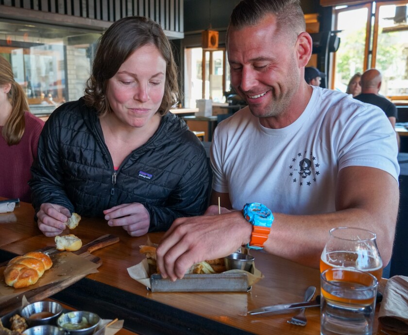 A couple enjoy tasting portions on a recent TastePro food tour in North Park.