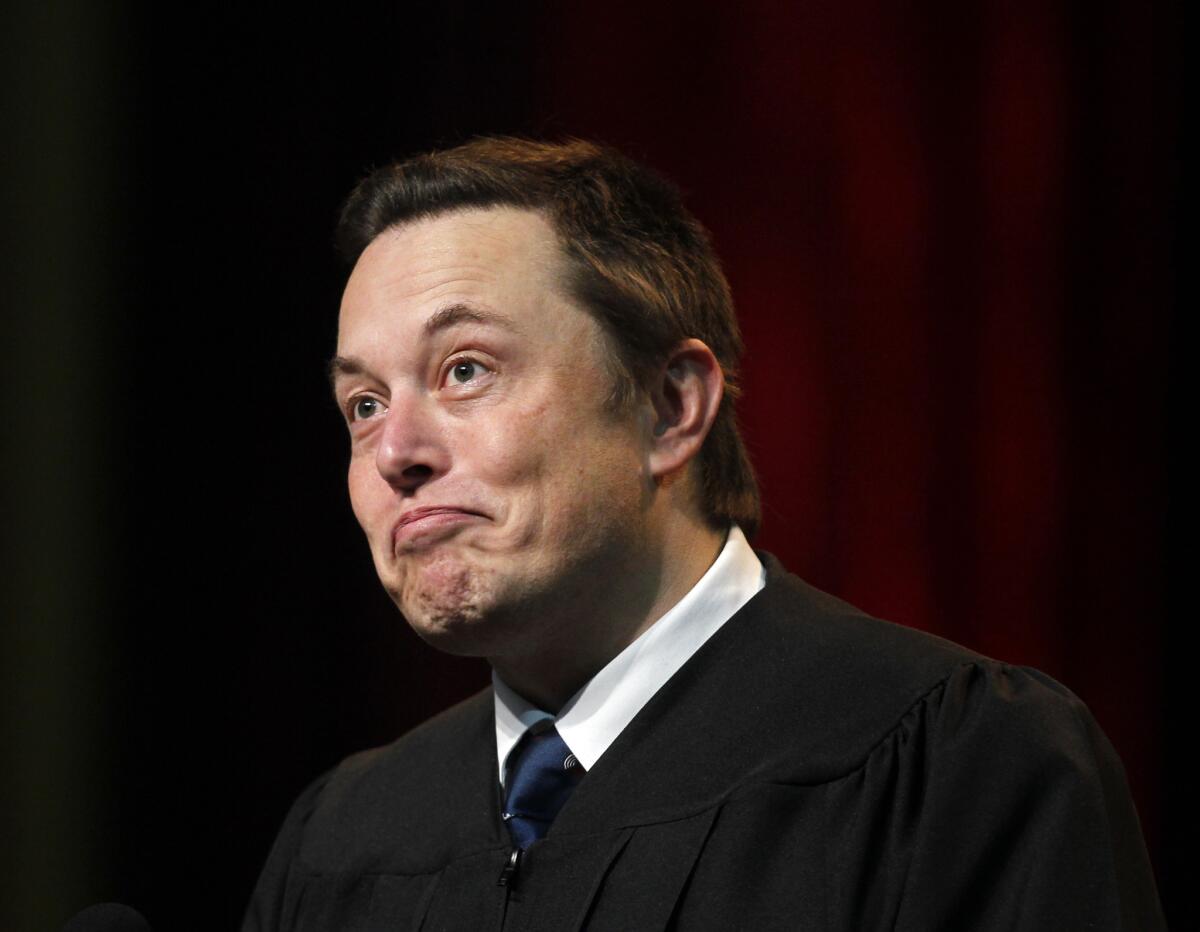 Tesla Motors Chief Executive Elon Musk, shown giving the commencement address at USC's Marshall School of Business on May 16, told shareholders that 2014 has been a great year and next year will be even better.
