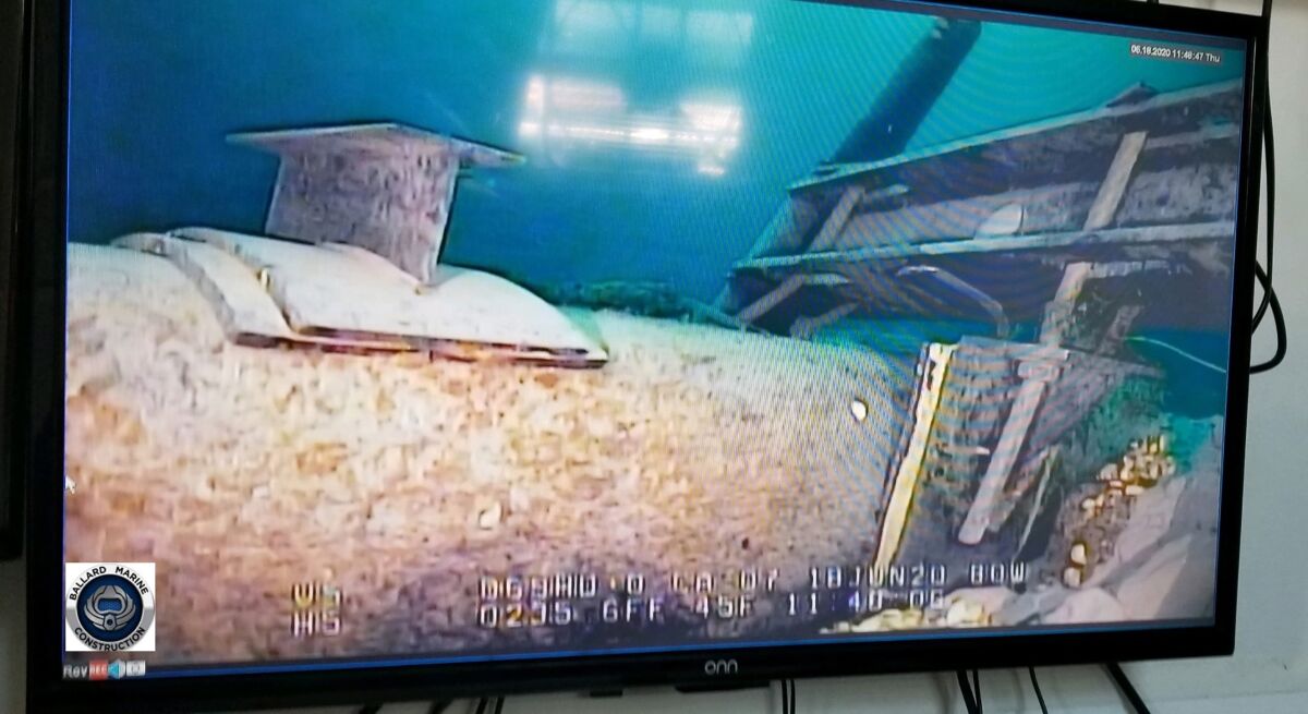 FILE - In this photo provided by the Michigan Department of Environment, Great Lakes, and Energy, footage played on a television screen shows damage to anchor support EP-17-1 on the east leg of the Enbridge Line 5 pipeline within the Straits of Mackinac, Mich., in June 2020. A federal review of plans for the Great Lakes oil pipeline tunnel will take more than a year longer than originally planned, officials said Thursday, March 23, 2023, likely delaying completion of the project — if approved — until 2030 or later. (Michigan Department of Environment, Great Lakes, and Energy via AP, File)