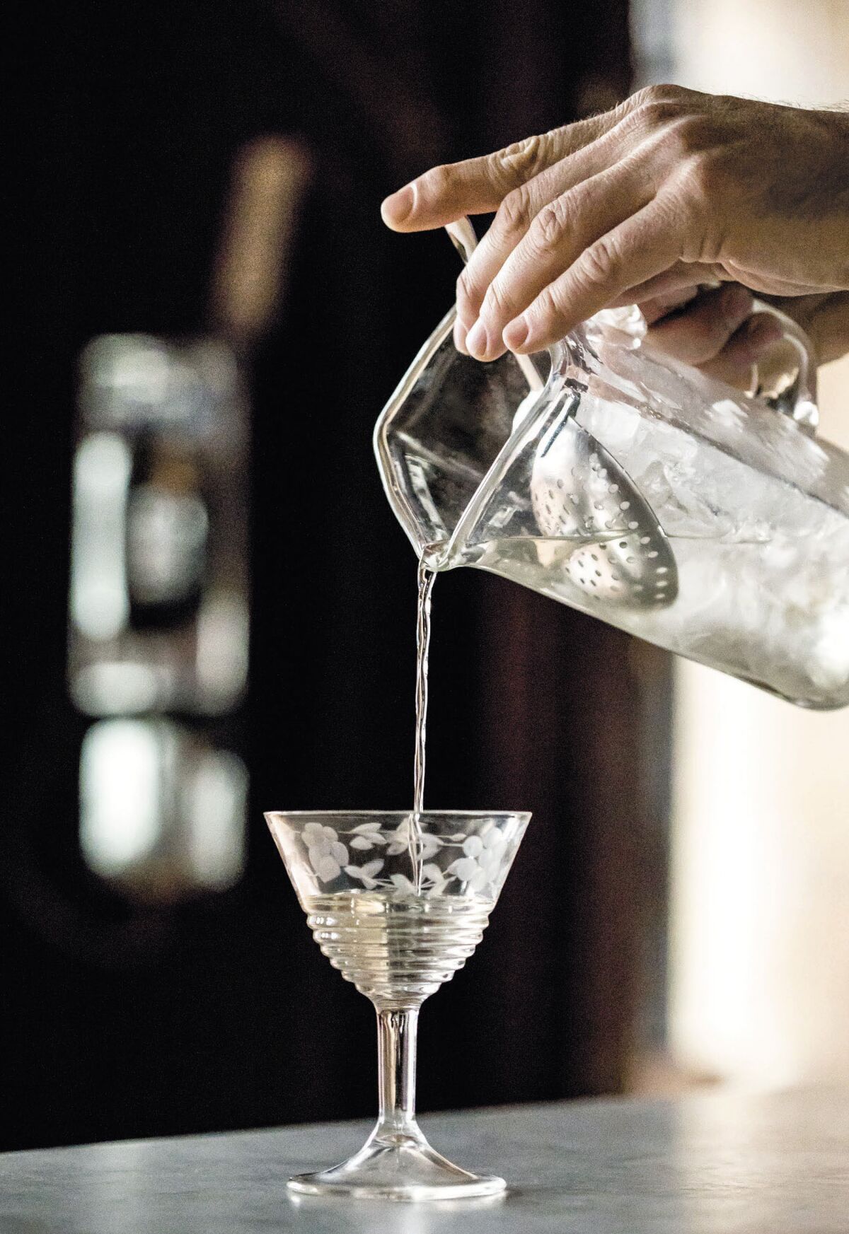 Pouring out a martini