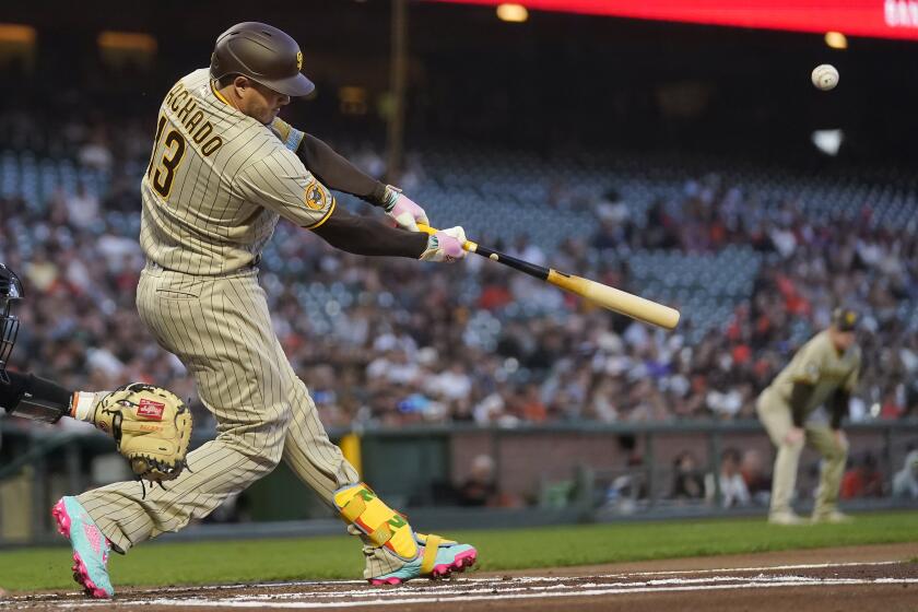 San Diego Padres' Manny Machado hits an RBI single against the San Francisco Giants during the first inning of a baseball game in San Francisco, Monday, Sept. 25, 2023. (AP Photo/Jeff Chiu)