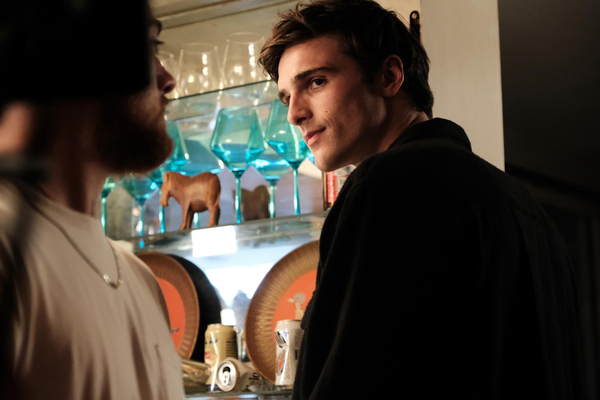 Two young men look at each other suspiciously in "Euphoria."