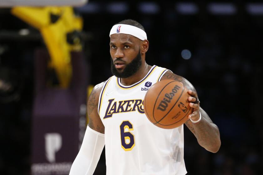 Los Angeles Lakers forward LeBron James (6) dribbles against the Memphis Grizzlies during the second half of an NBA basketball game in Los Angeles, Sunday, Oct. 24, 2021. The Lakers won 121-118. (AP Photo/Ringo H.W. Chiu)